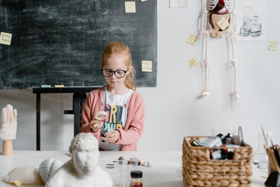Girl experimenting with rocks in a classroom. Engaged in scientific learning and exploration.