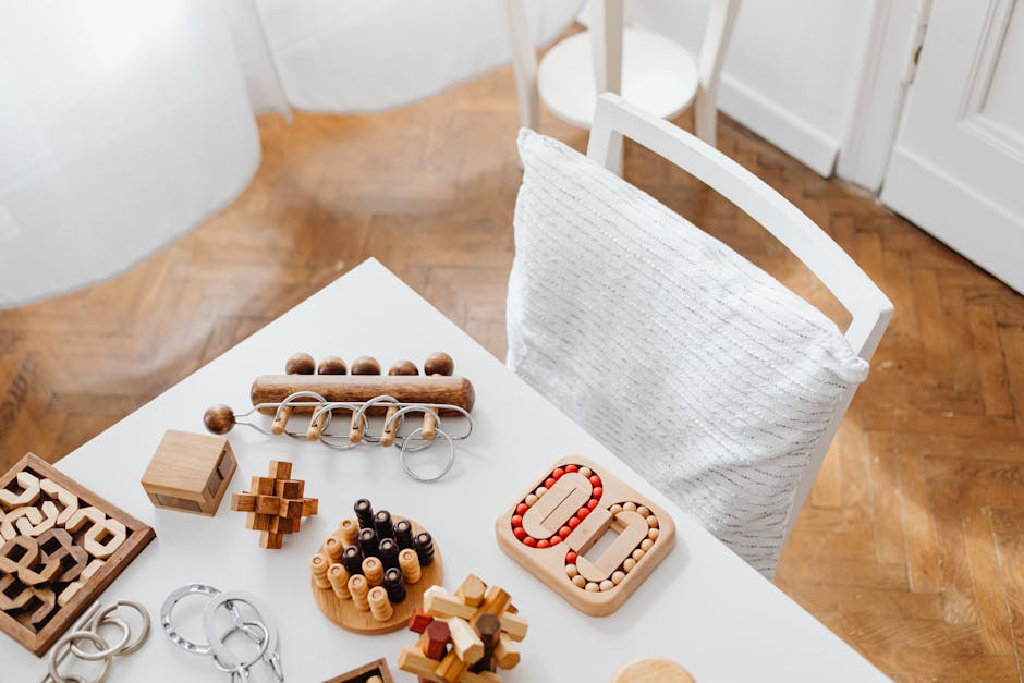 A collection of wooden puzzle toys arranged on a modern table in an indoor setting, perfect for encouraging intellectual play.
