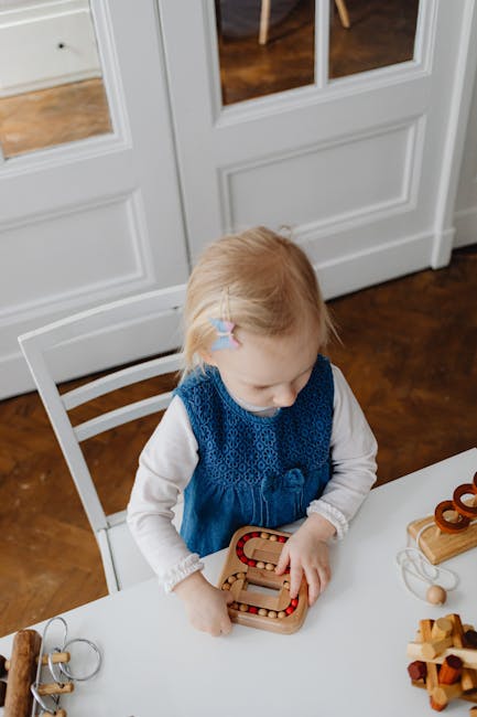 Young girl playing with wooden toys at home, enhancing childhood development and creativity.