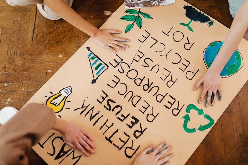 Children making an eco-friendly poster promoting recycling and waste reduction.